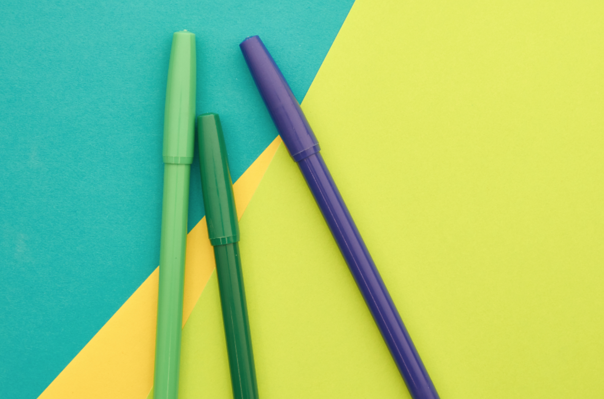 Markers on colorful background